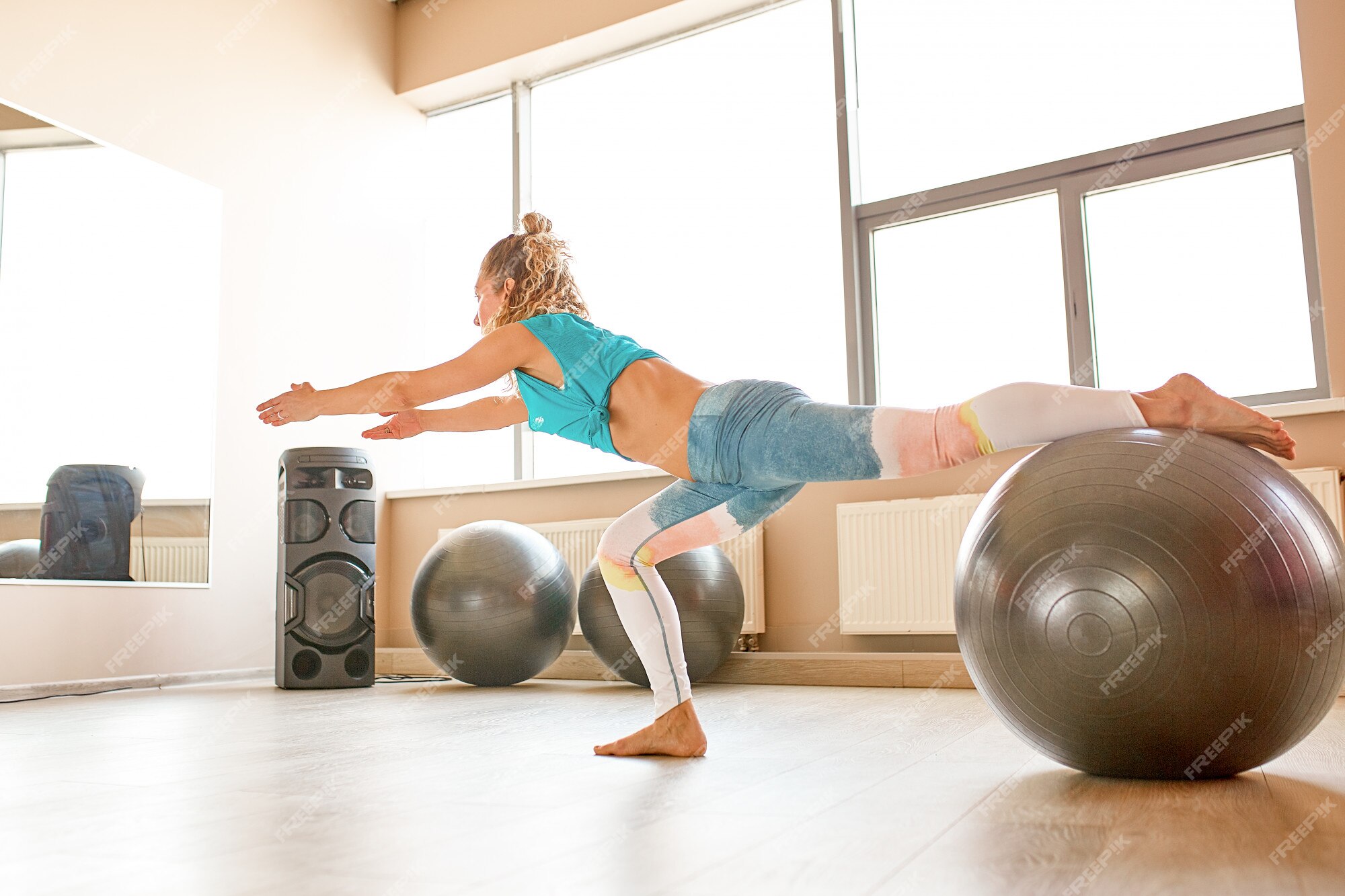 Premium Photo  Woman doing exercises with fitball in fitness gym class.  engaging core abdominal muscles. image concept of healthy lifestyle for  women.