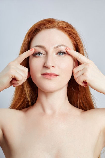 Woman doing facial massage