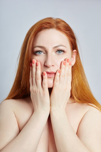 Woman doing facial massage