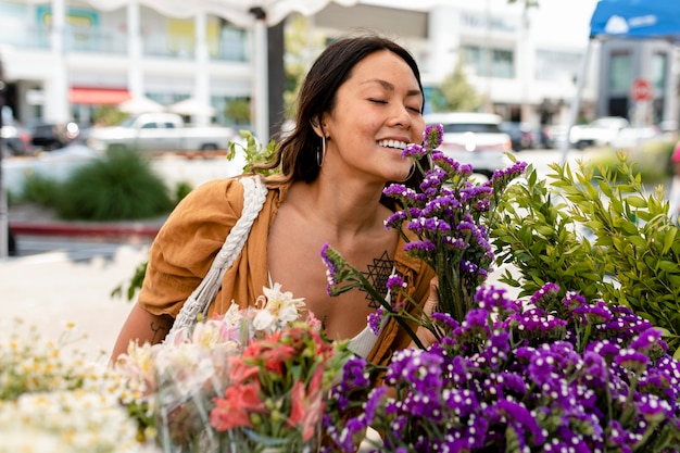 Woman doing flower shopping at a local market