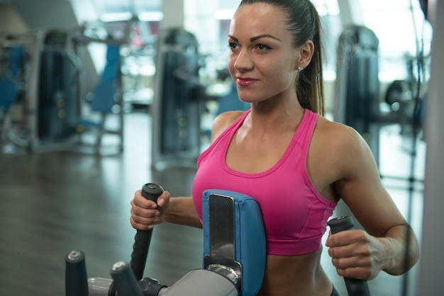 Woman Doing Heavy Weight Exercise For Back