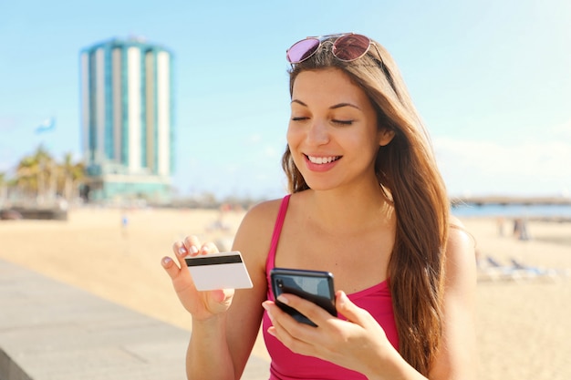 Woman doing an online payment with her smartphone