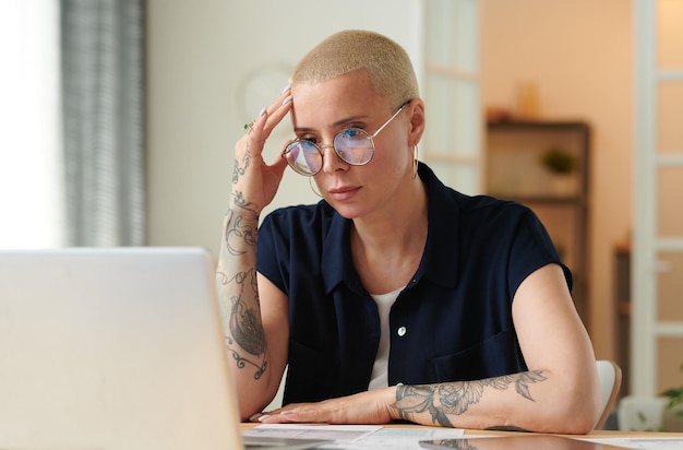 Woman doing overtime work at home