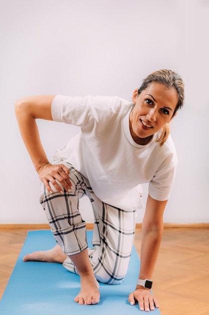 Woman Doing Sitting and Rising Test at Home