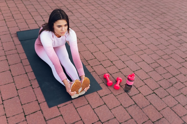 Woman doing stretching outdoors