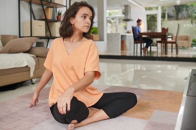 Woman doing twist yoga pose