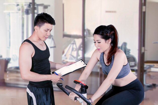 Woman doing workout with her personal instructor