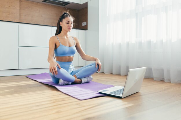 woman doing yoga at home