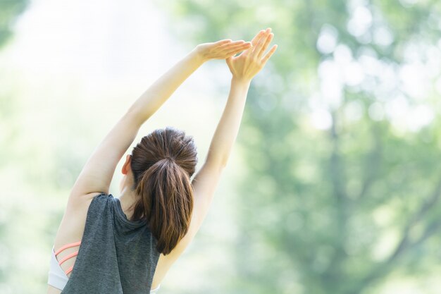 Woman doing yoga in the park