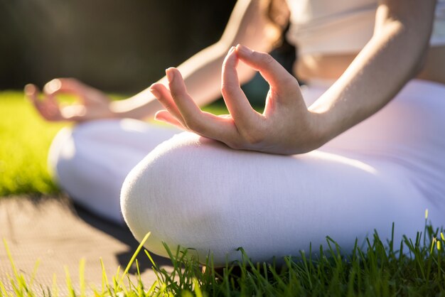 Woman doing yoga in a park