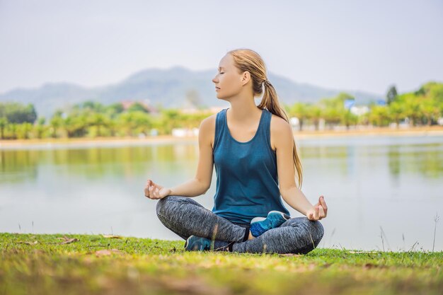 Woman doing yoga in a tropical park