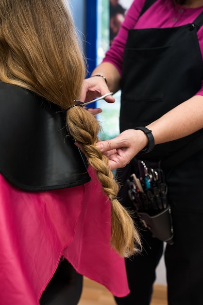 Woman donating hair for cancer