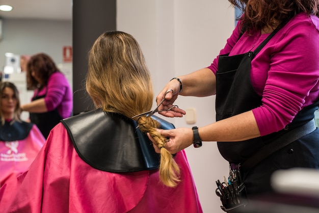 Woman donating hair for cancer