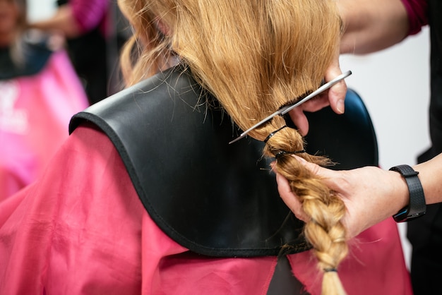 Woman donating hair for cancer