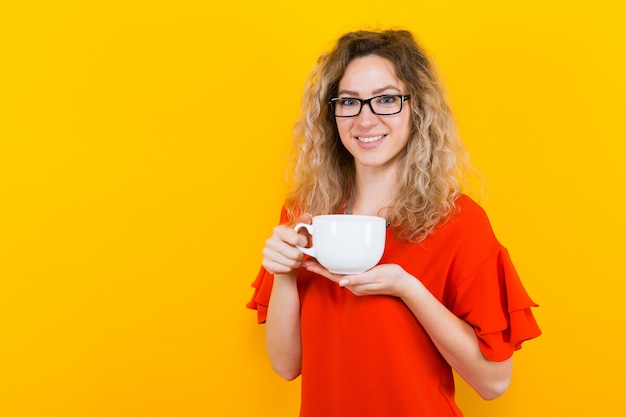 Woman in dress with cup