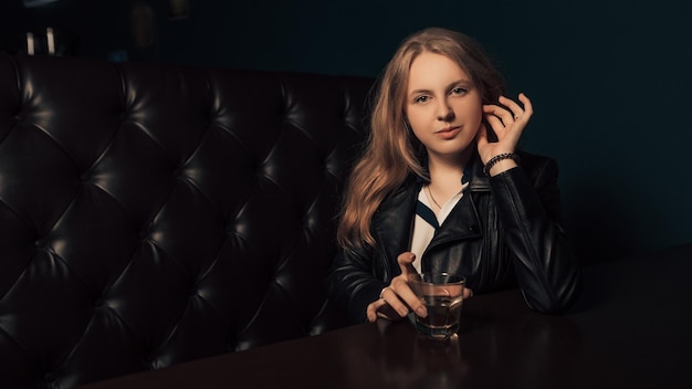 Woman drink alcohol in cafe