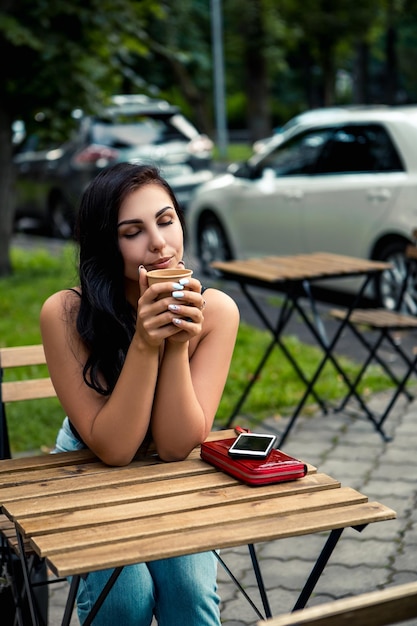 Woman drink coffee outside