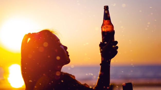 Woman drinking beer Beer glass celebrates softcolored beer drinks friendships gatherings by the sea relaxing days and eating and drinking Celebration idea with copy space