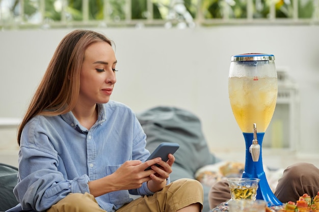 Woman Drinking Beer with Friends