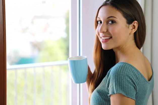 Woman drinking a cup of coffee