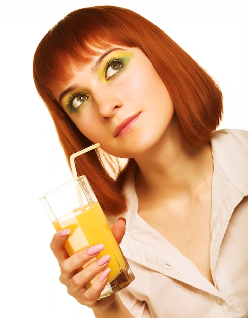 Woman drinking orange juice close up