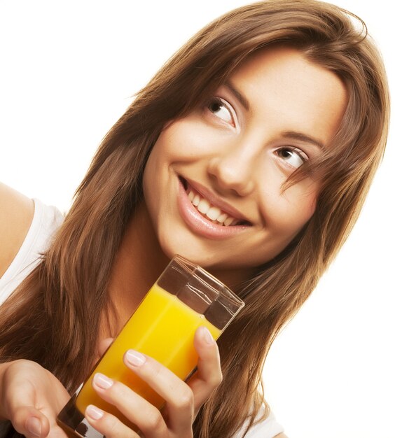 Woman drinking orange juice close up