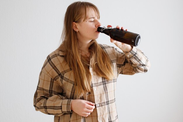 woman drinks beer alcoholism bad habits