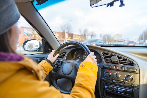 Woman drive car in cold winter weather