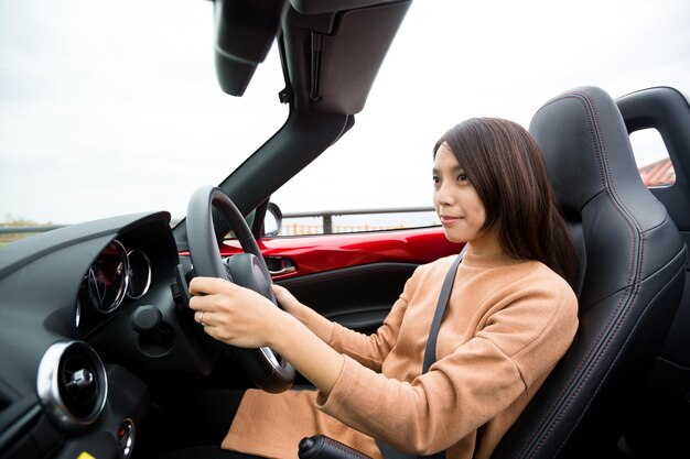 Woman driving cabriolet