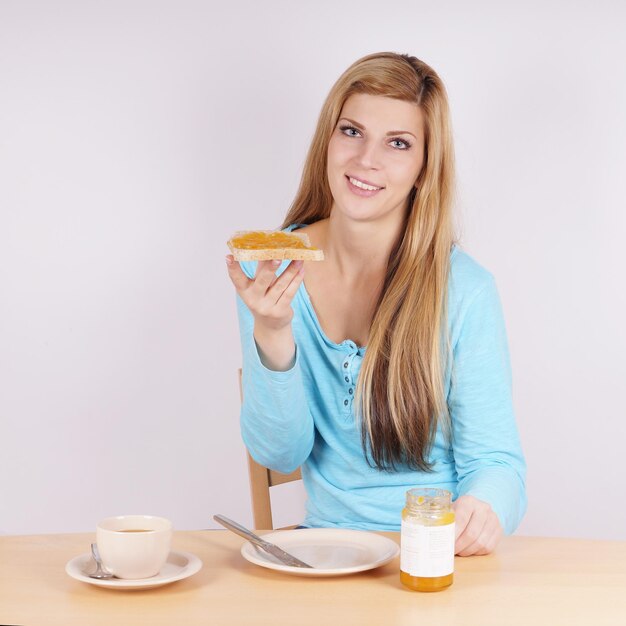 Woman eating breakfast