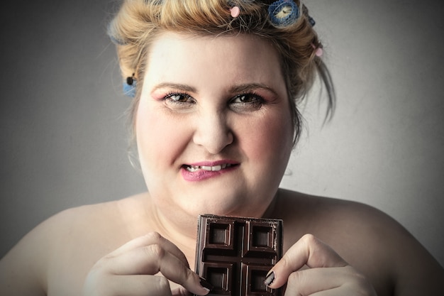 a woman eating chocolate