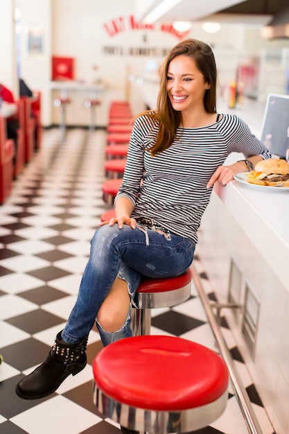 Woman eating in diner