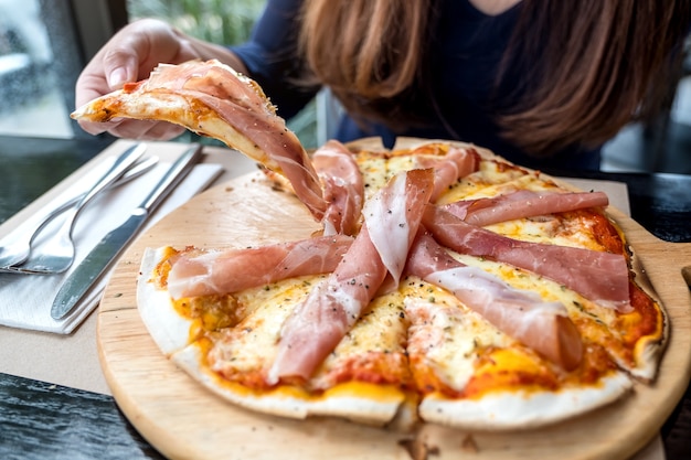 woman eating pizza