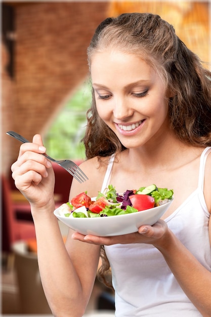 Woman eating salad