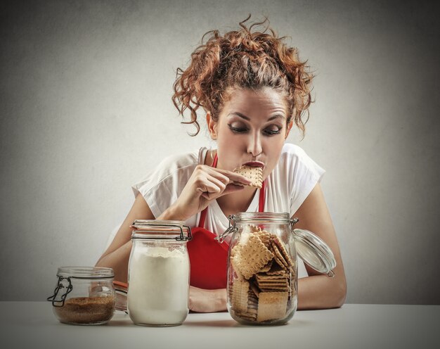 woman eats biscuit