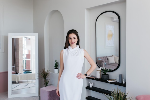 Woman in elegance white dress Girl in photostudio