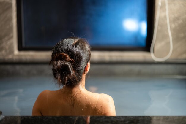 Woman enjoy the hot springs in resort