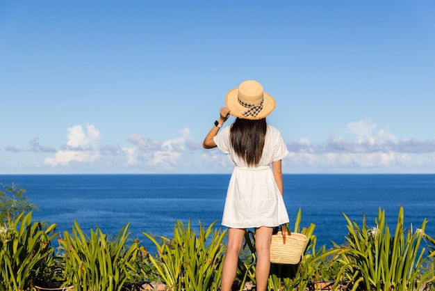 Woman enjoy the sea view in sunny day