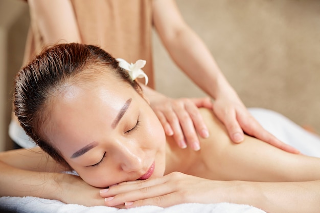 Woman enjoying back massage