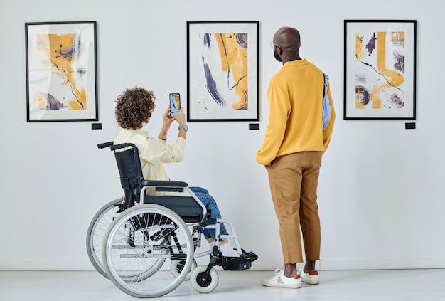 Woman enjoying modern art at gallery