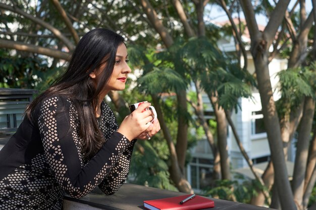 Woman enjoying morning coffee