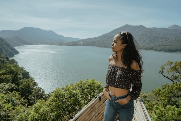 Woman enjoying nature from a hill top