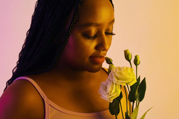 Woman enjoying smell of fresh flowers