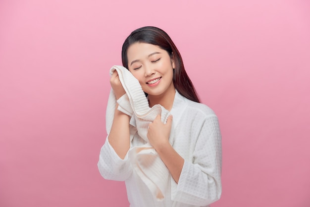 Woman enjoying the softness of a towel