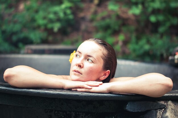 woman enjoying spa in hot tubs outdoors