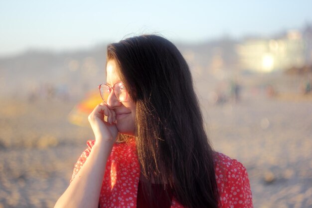 Woman enjoying the sunset on the beach