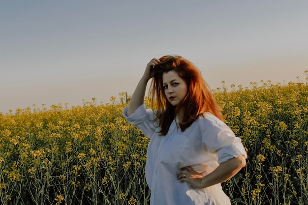 Woman enjoying the sunset in the filed