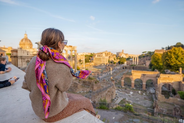 Woman enjoying view on the Roman forum in Rome