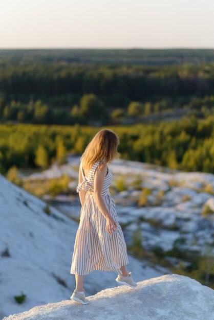 Woman enjoying walk in the mountains in summer