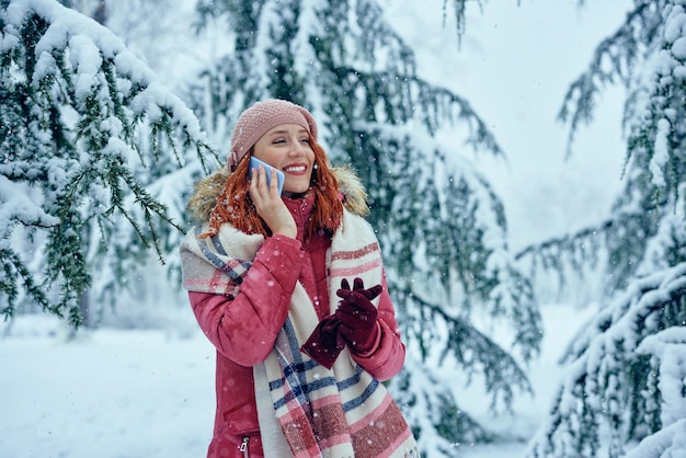 Woman enjoying a winter day and having call